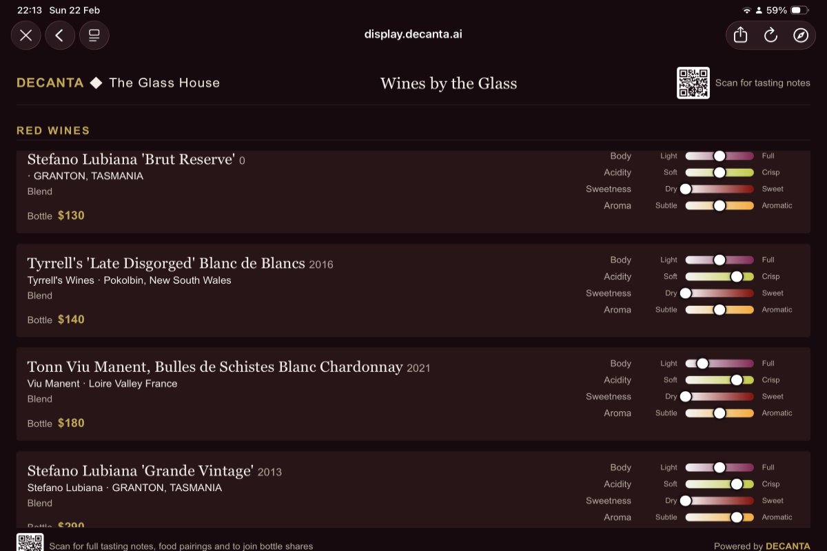 Decanta.ai digital wine display at The Glass House showing Wines by the Glass list with taste profile sliders for body, acidity, sweetness and aroma